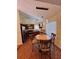 Kitchen dining area featuring stylish light fixture and view into the modern kitchen at 2315 Oakland Spring Dr, Snellville, GA 30039