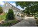 Backyard view with white pergola, gated entrance to the pool area, and lush greenery at 3906 Laurens Ln, Snellville, GA 30039