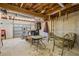 Unfinished basement space with exercise equipment and an exterior door at 3906 Laurens Ln, Snellville, GA 30039