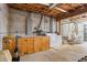 Unfinished basement with laundry area, utility sink, and wood cabinetry at 3906 Laurens Ln, Snellville, GA 30039