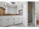 Bathroom with double sinks, vanity, granite countertop, and tile shower at 3906 Laurens Ln, Snellville, GA 30039