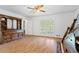 Bedroom featuring hardwood floors, white walls, and natural light streaming through the window at 3906 Laurens Ln, Snellville, GA 30039