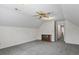 Spacious bedroom with neutral walls, ceiling fan, and grey carpeted floor at 3906 Laurens Ln, Snellville, GA 30039