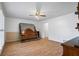 Spacious bedroom with hardwood floors, ceiling fan, and bright white walls at 3906 Laurens Ln, Snellville, GA 30039