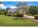 Charming home with neutral brick, dormer windows, and manicured landscaping on a lush green lawn at 3906 Laurens Ln, Snellville, GA 30039