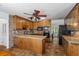 Traditional kitchen with granite counters, wood cabinets, tiled backsplash, and stainless steel appliances at 3906 Laurens Ln, Snellville, GA 30039