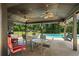 Covered patio with ceiling fans, outdoor furniture, and a view of the backyard pool at 3906 Laurens Ln, Snellville, GA 30039