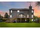 Expansive backyard showcasing the home's deck, and lush greenery at 4249 Caveat Ct, Fairburn, GA 30213