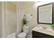 Neutral bathroom with shower-tub combo and dark wood vanity offers a relaxing private space at 4249 Caveat Ct, Fairburn, GA 30213