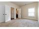 Bedroom with an ensuite bathroom and large closets offers ample space and convenience at 4249 Caveat Ct, Fairburn, GA 30213