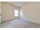 Cozy carpeted bedroom with ample natural light, perfect for relaxation at 4249 Caveat Ct, Fairburn, GA 30213