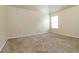 Bright and airy bedroom with neutral carpeting and a window letting in natural light at 4249 Caveat Ct, Fairburn, GA 30213