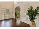 Bright foyer with hardwood floors, white trim, and decorative accents at 4249 Caveat Ct, Fairburn, GA 30213