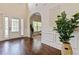Open and airy foyer with hardwood floors, wainscoting, and bright entryway at 4249 Caveat Ct, Fairburn, GA 30213