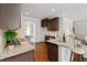 Well-appointed kitchen with granite countertops, dark cabinetry, and modern appliances at 4249 Caveat Ct, Fairburn, GA 30213