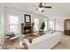 Inviting living room features a stone fireplace, plush seating, and abundant natural light at 4249 Caveat Ct, Fairburn, GA 30213
