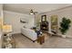 Cozy living room features a stone fireplace, neutral decor, and a ceiling fan at 4249 Caveat Ct, Fairburn, GA 30213