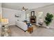 Bright living room features a stone fireplace, plush seating, and abundant natural light at 4249 Caveat Ct, Fairburn, GA 30213
