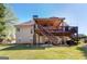 Spacious back deck, accessible by stairs, with a roof and a ceiling fan at 149 Crown Glen Way, Stockbridge, GA 30281