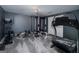 Fully-equipped home gym in basement features modern exercise equipment and ample space for a complete workout at 149 Crown Glen Way, Stockbridge, GA 30281