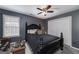 Bedroom with window, closet, and dark blue accent wall at 149 Crown Glen Way, Stockbridge, GA 30281