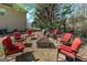 Seating area with a fire pit featuring six red chairs at 149 Crown Glen Way, Stockbridge, GA 30281