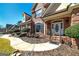 Inviting front entrance with brick facade, arched doorway, and beautifully landscaped walkway at 149 Crown Glen Way, Stockbridge, GA 30281