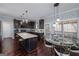 Modern kitchen with island, stainless steel appliances, and stylish pendant lighting at 149 Crown Glen Way, Stockbridge, GA 30281