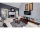 Comfortable living room with fireplace, ample seating, and stylish decor at 149 Crown Glen Way, Stockbridge, GA 30281