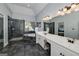 Modern primary bathroom featuring a glass shower, a soaking tub and double vanity sinks at 149 Crown Glen Way, Stockbridge, GA 30281
