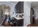 Cozy work station with storage, integrated desk, and direct access to the kitchen and dining area at 149 Crown Glen Way, Stockbridge, GA 30281