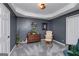 A tranquil sitting room with a comfy armchair, a wooden dresser, and soft carpet, creating a cozy retreat at 149 Crown Glen Way, Stockbridge, GA 30281