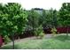 Backyard with mature trees and a lush lawn at 326 Still Pine Bnd, Smyrna, GA 30082