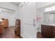 Bathroom featuring a sliding barn door, wood floors, and granite vanity at 326 Still Pine Bnd, Smyrna, GA 30082