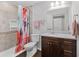 Updated bathroom with neutral tile and granite vanity at 326 Still Pine Bnd, Smyrna, GA 30082