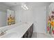The bathroom features a dual sink vanity, a shower/tub combo, and a decorative floral shower curtain at 326 Still Pine Bnd, Smyrna, GA 30082