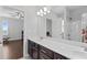 This modern bathroom features a vanity, a shower and a view into a bedroom at 326 Still Pine Bnd, Smyrna, GA 30082
