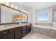 Elegant bathroom featuring granite countertops, a soaking tub, and a walk-in glass shower at 326 Still Pine Bnd, Smyrna, GA 30082