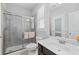 Modern bathroom with a glass-enclosed shower, a white vanity, and a large mirror at 326 Still Pine Bnd, Smyrna, GA 30082