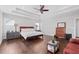 Main bedroom featuring hardwood floors, tray ceiling and natural light from the windows at 326 Still Pine Bnd, Smyrna, GA 30082