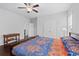 A cozy bedroom is filled with natural light, thanks to the large windows. A stylish ceiling fan provides comfort at 326 Still Pine Bnd, Smyrna, GA 30082