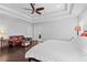 Bright main bedroom with a decorative tray ceiling and a sitting area with a leather couch at 326 Still Pine Bnd, Smyrna, GA 30082