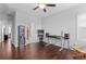 Bright bedroom featuring modern audio setup, wood floors, and a ceiling fan at 326 Still Pine Bnd, Smyrna, GA 30082