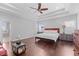 Spacious main bedroom with a tray ceiling and a connecting bathroom with a glass shower at 326 Still Pine Bnd, Smyrna, GA 30082