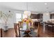 Cozy dining area features a modern light fixture and a glass-top table with seating for four at 326 Still Pine Bnd, Smyrna, GA 30082
