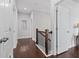 Hallway featuring hardwood floors, white trim, and doors at 326 Still Pine Bnd, Smyrna, GA 30082