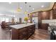 Open kitchen featuring a large island, stainless steel appliances, and wood floors at 326 Still Pine Bnd, Smyrna, GA 30082