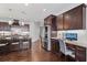 Beautiful kitchen featuring granite countertops, a large island, stainless steel appliances, and custom dark wood cabinetry at 326 Still Pine Bnd, Smyrna, GA 30082