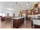 Open kitchen featuring a large island, stainless steel appliances, and wood floors at 326 Still Pine Bnd, Smyrna, GA 30082