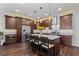 Open kitchen featuring a large island, stainless steel appliances, and wood floors at 326 Still Pine Bnd, Smyrna, GA 30082